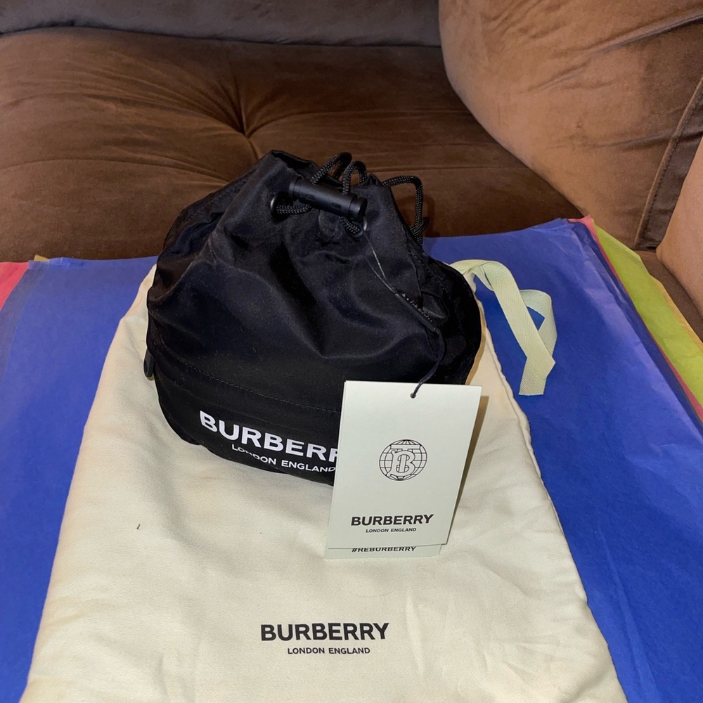 Small black Burberry wristlet with drawstring never used